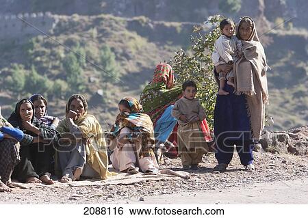 Stock Photograph - Women In A Burial Procession After The 8 October 2005 Earthquake, Chikar, Azad Kashmir, Pakistan. Fotosearch