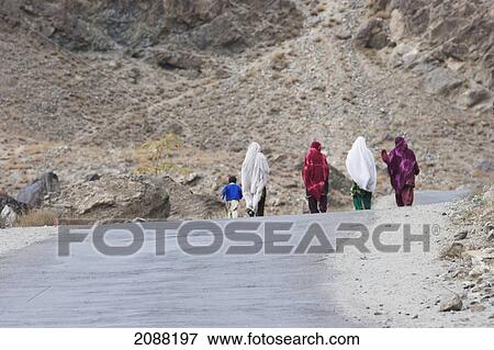 Stock Photo - Women On Highway S1 From Gilgit To Skardu, Northern Areas, Pakistan. Fotosearch