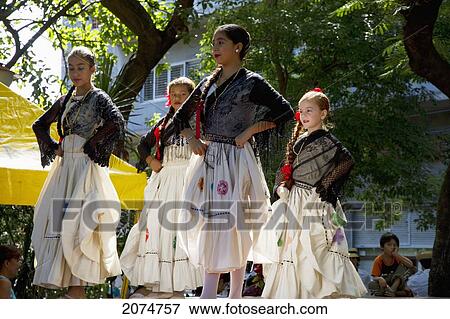 Stock Photo - Women Wearing Traditional Dress Performing A Paraguayan Polka, Asuncion, Paraguay. Fotosearch