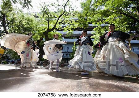 Stock Photo - Women Wearing Traditional Dress Performing A Paraguayan Polka, Asuncion, Paraguay. Fotosearch