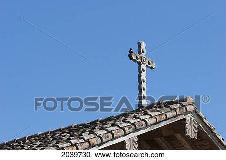 Stock Image - Wooden Cross On The Roof Of The Jesuit Mission Of San Javier De Velasco, Santa Cruz Department, Bolivia. Fotosearch