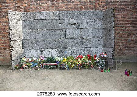 Wreaths, Flowers And Candles Laid By The 'black Wall' Execution Site, Auschwitz Concentration Camp, Oswiecim, Malopolska, Poland View Large Photo Image Stock Image - Wreaths, Flowers And Candles Laid By The 'black Wall' Execution Site, Auschwitz Concentration Camp, Oswiecim, Malopolska, Poland. Fotosearch