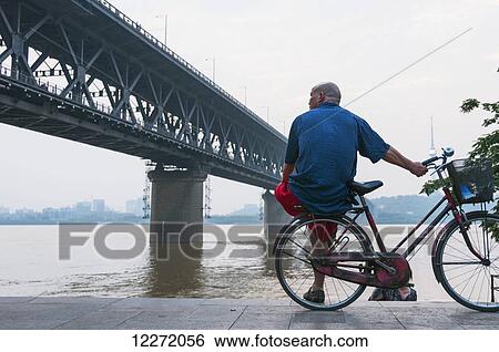 Wuhan Bridge crossing Yangtze river at sunset; Wuhan, Hubei province, China View Large Photo Image Stock Photograph - Wuhan Bridge crossing Yangtze river at sunset; Wuhan, Hubei province, China. Fotosearch