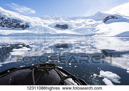 Stock Photograph - Zodiac cruising in Neko Harbour; Antarctica. Fotosearch
