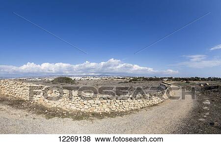 A curve in a gravel road and stone wall; Paphos, Cyprus View Large Photo Image Stock Photo - A curve in a gravel road and stone wall; Paphos, Cyprus. Fotosearch