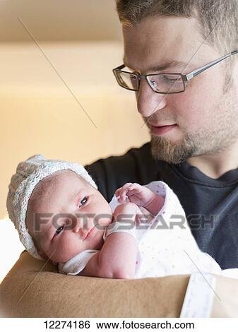 A father with his newborn daughter; Chilliwack, British Columbia, Canada View Large Photo Image Stock Photograph - A father with his newborn daughter; Chilliwack, British Columbia, Canada. Fotosearch