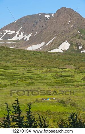Picture - A group of people camping near Powerline Pass in the Chugach State Park on a summer day in South Central Alaska; Alaska, United States of America. Fotosearch