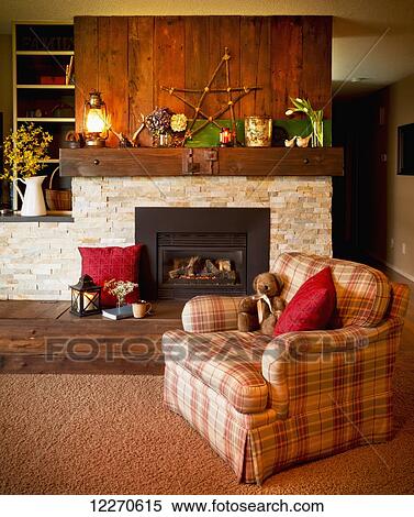 A living room chair in front of the fireplace; Yarrow, British Columbia, Canada View Large Photo Image Stock Photography - A living room chair in front of the fireplace; Yarrow, British Columbia, Canada. Fotosearch