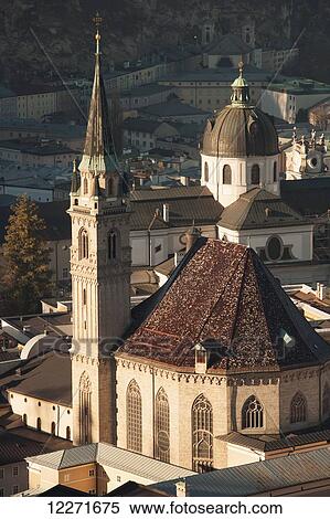 A view from the castle over the city's rooftops with the roof and bell tower of the Franziskanerkirche (Franciscan church); Salzburg, Austria View Large Photo Image Stock Photography - A view from the castle over the city's rooftops with the roof and bell tower of the Franziskanerkirche (Franciscan church); Salzburg, Austria. Fotosearch