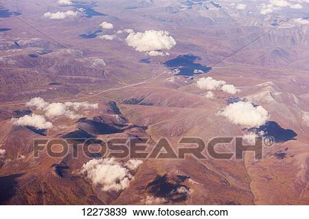 Stock Photo - Aerial view of clouds obscuring the Kigluaik mountains, North of Nome, Seward Peninsula; Alaska, United States of America. Fotosearch