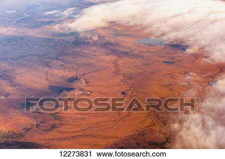 Stock Image - Aerial view of clouds over the Kigluaik Mountains, North of Nome, Seward Peninsula; Alaska, United States of America. Fotosearch