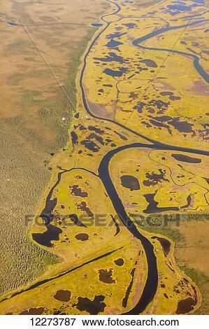 Aerial view of wetlands and tundra along the Noatak River Delta; Noatak, Alaska, United States of America View Large Photo Image Stock Photo - Aerial view of wetlands and tundra along the Noatak River Delta; Noatak, Alaska, United States of America. Fotosearch