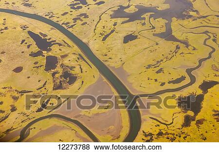 Stock Photo - Aerial view of wetlands and tundra along the Noatak River Delta; Noatak, Alaska, United States of America. Fotosearch
