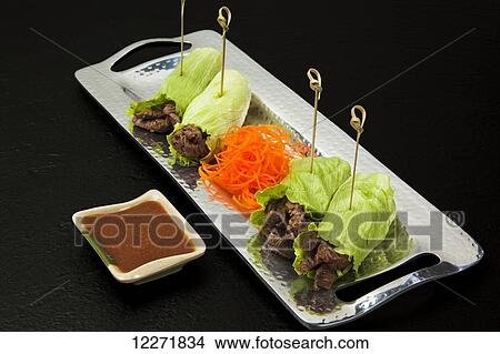 Asian Hand Rolls with dipping sauce View Large Photo Image Picture - Asian Hand Rolls with dipping sauce. Fotosearch