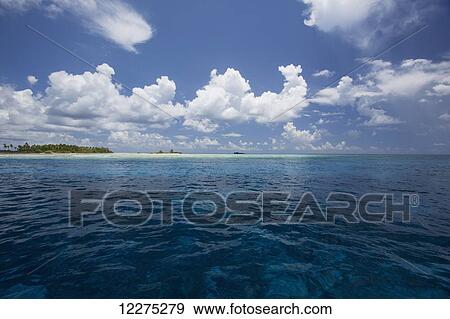 Atoll with ship in the distance; Tahiti View Large Photo Image Stock Photo - Atoll with ship in the distance; Tahiti. Fotosearch