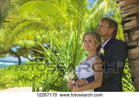 Stock Image - Beach wedding; Kauai, Hawaii, United States of America. Fotosearch