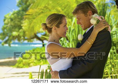 Stock Image - Beach wedding; Kauai, Hawaii, United States of America. Fotosearch