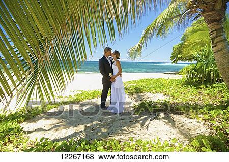 Stock Photo - Beach wedding; Kauai, Hawaii, United States of America. Fotosearch