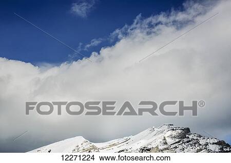 Picture - Blue sky and clouds of the Rocky Mountains, Banff National Park; Banff, Alberta, Canada. Fotosearch