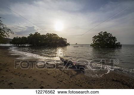 Boat and mangroves in Areia Branca; Dili, East Timor View Large Photo Image Stock Image - Boat and mangroves in Areia Branca; Dili, East Timor. Fotosearch
