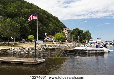 Boats docked with the American Flag flying; McGregor, Iowa, United States of America View Large Photo Image Stock Image - Boats docked with the American Flag flying; McGregor, Iowa, United States of America. Fotosearch