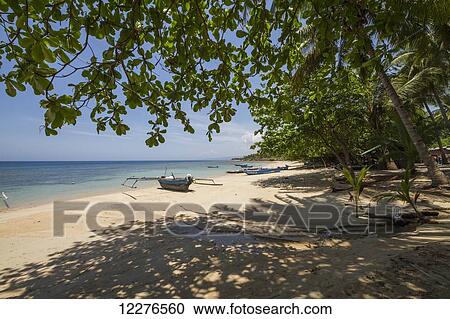 Stock Image - Boats on Pantai Wataboo Beach; Osoalata, Baucau, East Timor. Fotosearch