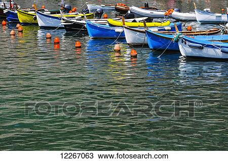 Stock Image - Boats tied up in the harbour; Vernazza, Liguria, Italy. Fotosearch