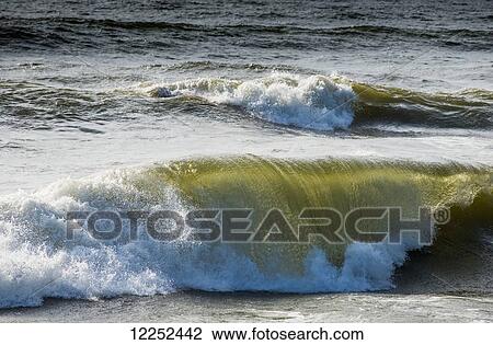 Stock Image - Breaking waves; Cannon Beach, Oregon, United States of America. Fotosearch