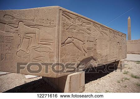 Carved relief of Queen Hatshepsut being crowned by God Amun, Hatshepsut's fallen obelisk, Karnak Temple; Luxor, Egypt View Large Photo Image Stock Photograph - Carved relief of Queen Hatshepsut being crowned by God Amun, Hatshepsut's fallen obelisk, Karnak Temple; Luxor, Egypt. Fotosearch