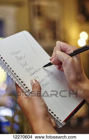 Checklist of names for Christmas shopping list; Ontario, Canada View Large Photo Image Picture - Checklist of names for Christmas shopping list; Ontario, Canada. Fotosearch
