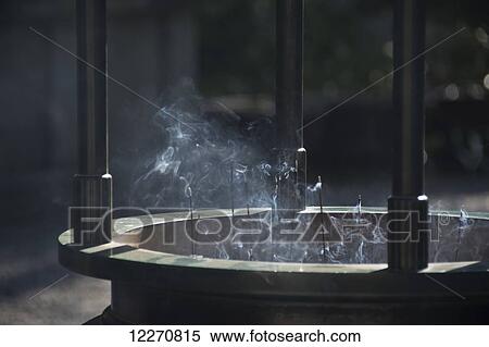 Stock Photography - Close up of a large incense vase with smoking sticks; Ohara, Kyoto, Japan. Fotosearch