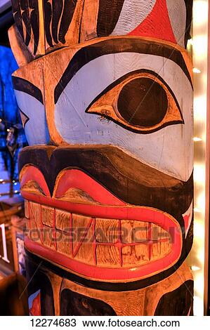 Close up of a totem pole with Christmas lights; Anchorage, Alaska, United States of America View Large Photo Image Stock Image - Close up of a totem pole with Christmas lights; Anchorage, Alaska, United States of America. Fotosearch