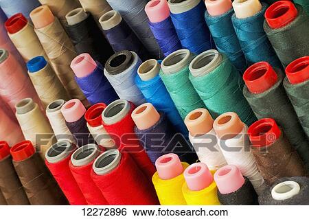 Stock Photograph - Close up of colourful thread spools; Calgary, Alberta, Canada. Fotosearch
