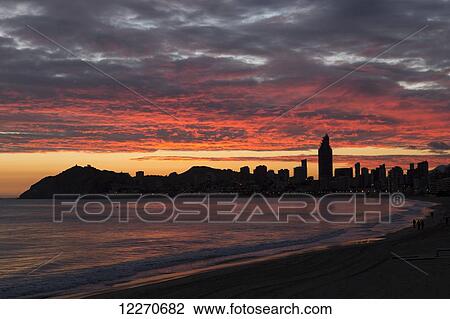 Colourful dramatic sunset over the silhouetted skyline; Benidorm, Spain View Large Photo Image Stock Image - Colourful dramatic sunset over the silhouetted skyline; Benidorm, Spain. Fotosearch
