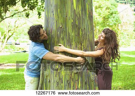 Stock Photograph - Couple in arboretum; Kauai, Hawaii, United States of America. Fotosearch