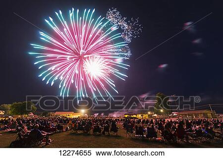 Crowd of people viewing the fourth of July fireworks; Earlville, Iowa, United States of America View Large Photo Image Stock Photography - Crowd of people viewing the fourth of July fireworks; Earlville, Iowa, United States of America. Fotosearch