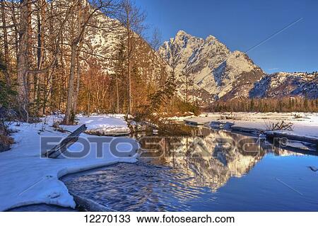 Stock Image - Eagle River Valley on a sunny winter day in South Central Alaska with Mount Yukla in the background, Chugach State Park; Alaska, United States of America. Fotosearch