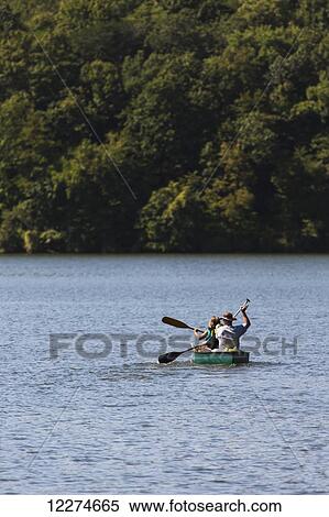 Stock Photography - Family canoeing on Lake Macbride at Lake Macbride State Park, near Solon; Iowa, United States of America. Fotosearch