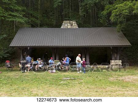 Family having a picnic at Bixby State Preserve, near Edgewood; Iowa, United States of America View Large Photo Image Stock Image - Family having a picnic at Bixby State Preserve, near Edgewood; Iowa, United States of America. Fotosearch