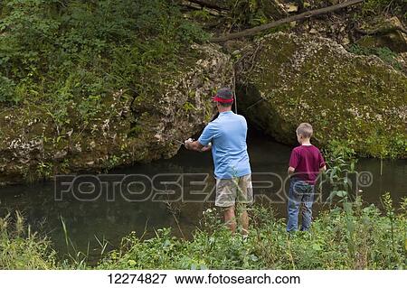 Father and son fishing in Bear Creek at Bixby State Preserve, near Edgewood; Iowa, United States of America View Large Photo Image Stock Photo - Father and son fishing in Bear Creek at Bixby State Preserve, near Edgewood; Iowa, United States of America. Fotosearch