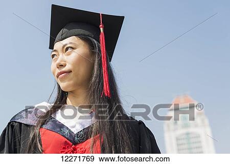 Stock Photo - Female student at University graduation; Xiamen, Fujian, China. Fotosearch