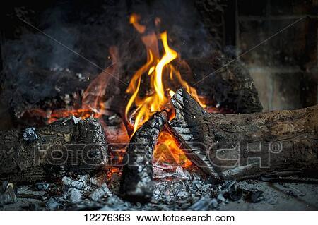 Fire burning in a fireplace; Tarragona, Benissanet, Spain View Large Photo Image Stock Image - Fire burning in a fireplace; Tarragona, Benissanet, Spain. Fotosearch