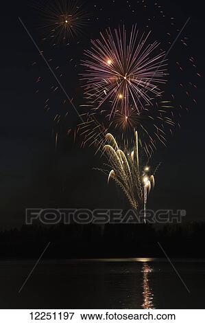 Fireworks reflecting off a lake; Calgary, Alberta, Canada View Large Photo Image Stock Photo - Fireworks reflecting off a lake; Calgary, Alberta, Canada. Fotosearch