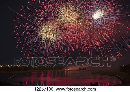 Fireworks reflecting on a lake; Calgary, Alberta, Canada View Large Photo Image Stock Image - Fireworks reflecting on a lake; Calgary, Alberta, Canada. Fotosearch