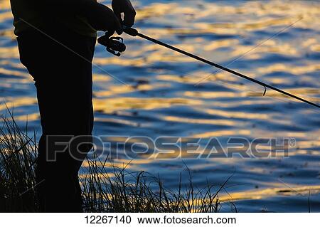 Fishing at sunset in the Porcupine River; Yukon, Canada View Large Photo Image Stock Image - Fishing at sunset in the Porcupine River; Yukon, Canada. Fotosearch