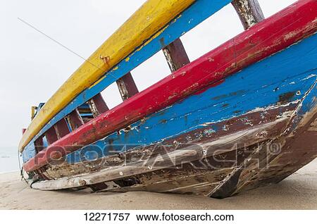 Stock Photo - Fishing boat on the beach; Xiamen, Fujian Province, China. Fotosearch