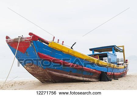 Fishing boat on the beach; Xiamen, Fujian Province, China View Large Photo Image Stock Photograph - Fishing boat on the beach; Xiamen, Fujian Province, China. Fotosearch