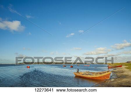 Fishing boats along the shore and in the water; Laguna de Rocha, Uruguay View Large Photo Image Stock Image - Fishing boats along the shore and in the water; Laguna de Rocha, Uruguay. Fotosearch