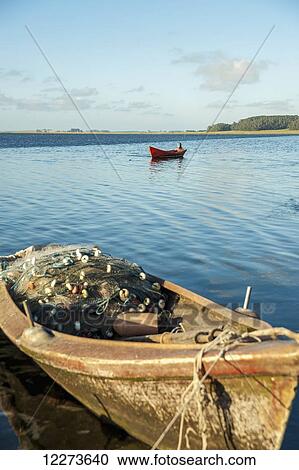 Stock Image - Fishing boats in a lake; Laguna de Rocha, Uruguay. Fotosearch