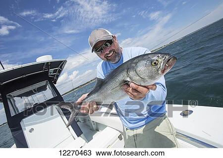 Stock Image - Fishing for Blue fish off the Atlantic coast; Massachusetts, United States of America. Fotosearch